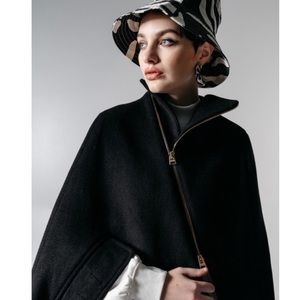 Quaint gold zip cape.